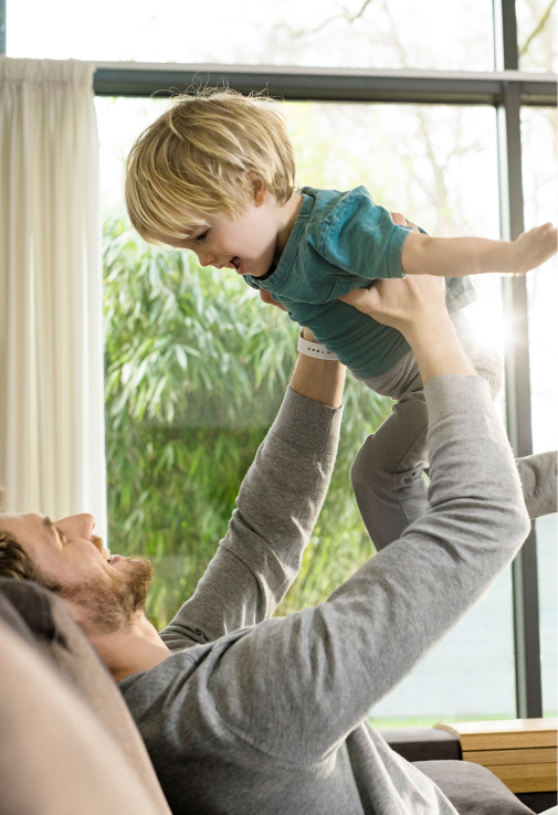 Father and child playing inside